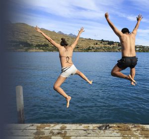 Couple enjoying summer at the lake without glasses after LASIK surgery